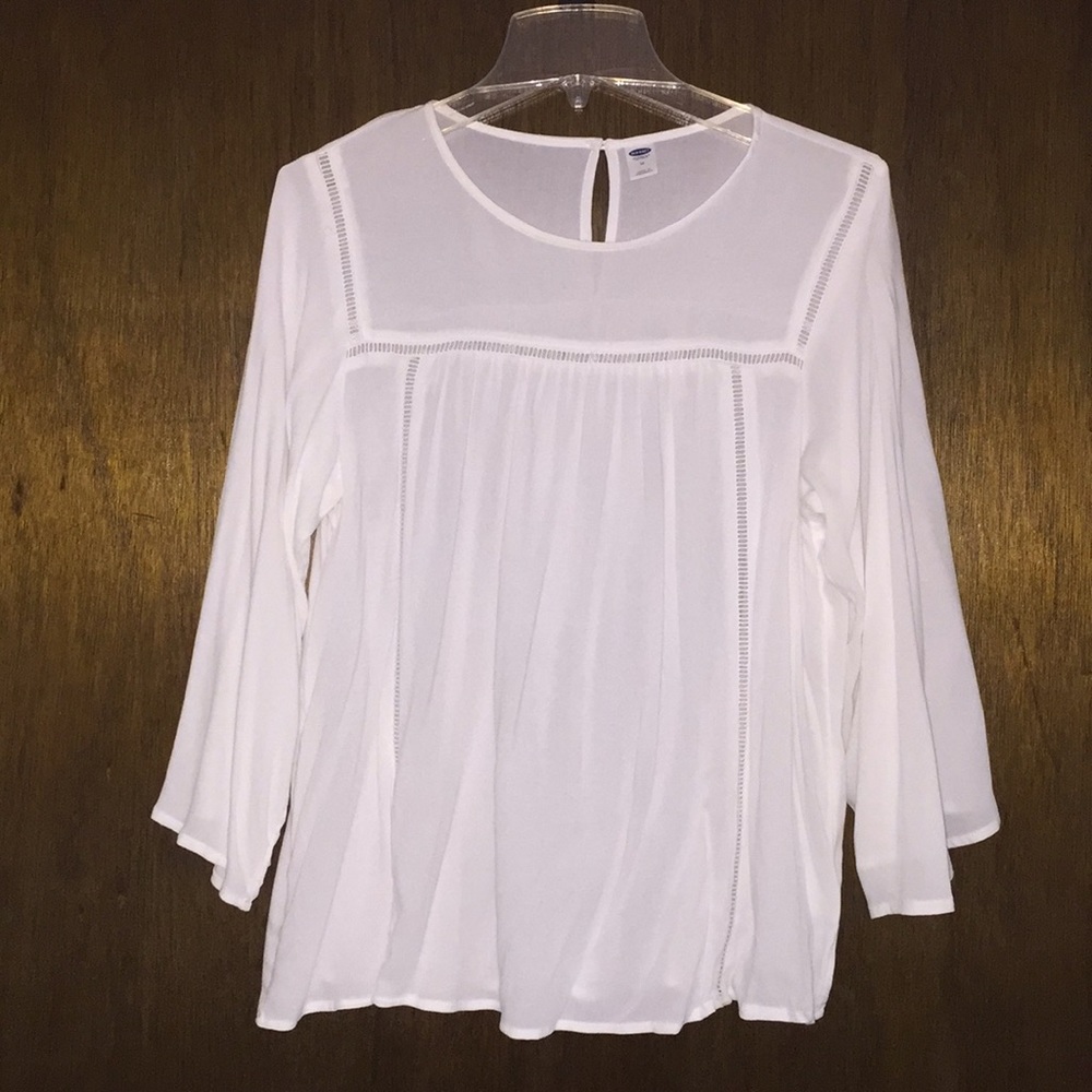 White bell sleeve top.